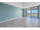 Bedroom with blue walls, tile floors and balcony access at 6372 Palma Del Mar S Blvd # 505, St Petersburg, FL 33715