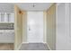 Condo entryway with white door and adjacent kitchen view at 6372 Palma Del Mar S Blvd # 505, St Petersburg, FL 33715