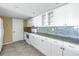 White kitchen with granite countertops and stainless steel appliances at 6372 Palma Del Mar S Blvd # 505, St Petersburg, FL 33715