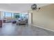 Bright living room with tile floors, large windows, and ample seating at 6372 Palma Del Mar S Blvd # 505, St Petersburg, FL 33715
