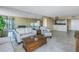 Living room with hardwood floors and a large mirror at 6372 Palma Del Mar S Blvd # 505, St Petersburg, FL 33715