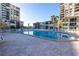 Community pool with surrounding lounge chairs at 6372 Palma Del Mar S Blvd # 505, St Petersburg, FL 33715
