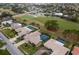 Aerial view of houses and golf course at 6760 Burning Tree Dr, Seminole, FL 33777