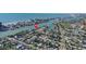 Top-down view of the property, emphasizing waterfront access and the surrounding residential area at 8020 Coquina Way, St Pete Beach, FL 33706