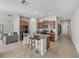 Kitchen with island, dark brown cabinets, and black appliances at 10119 Rose Petal Pl, Riverview, FL 33578