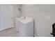 Laundry room with washer, dryer, and overhead shelving at 10119 Rose Petal Pl, Riverview, FL 33578