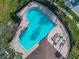 Grand piano shaped community pool with lounge chairs at 10119 Rose Petal Pl, Riverview, FL 33578