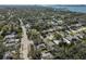 Aerial view of a residential neighborhood near the coast, showcasing various houses and lush greenery at 1154 Commodore St, Clearwater, FL 33755