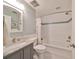 Updated bathroom features a granite vanity, subway tile shower, and a bathtub at 1154 Commodore St, Clearwater, FL 33755