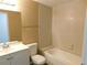 Bathroom with tub and updated vanity at 124 Loblolly Ct # C, Oldsmar, FL 34677