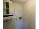 Small laundry room with water heater and hookups at 124 Loblolly Ct # C, Oldsmar, FL 34677