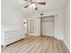 Another view of the bedroom highlighting the closet and wood-look flooring at 13682 Orange Sunset Dr # 102, Tampa, FL 33618