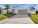 Newly renovated home exterior, featuring a clean aesthetic and attractive landscaping at 2050 Bayou Grande Ne Blvd, St Petersburg, FL 33703