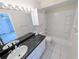 Clean bathroom with bathtub, shower, and vanity at 2060 6Th St, Sarasota, FL 34237