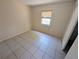 Spacious bedroom with tile flooring and window at 2060 6Th St, Sarasota, FL 34237