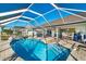 Relaxing pool area with a screened enclosure at 2061 Rio De Janeiro Ave, Punta Gorda, FL 33983