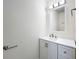 Simple bathroom with white vanity and a large mirror at 2529 Harn Blvd # 5, Clearwater, FL 33764