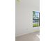 Bright bedroom featuring a large window offering exterior views, creating an open and airy atmosphere at 3065 Winding Creek Trl, North Port, FL 34289