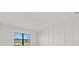 Bright bedroom featuring a large window that let in natural light at 3065 Winding Creek Trl, North Port, FL 34289