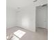 Well-lit bedroom with double closet doors and tile flooring for a clean and modern look and feel at 3065 Winding Creek Trl, North Port, FL 34289