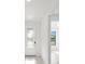 Bright entryway features a decorative glass front door and a glimpse into the adjacent living space at 3065 Winding Creek Trl, North Port, FL 34289