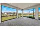 Screened-in lanai offers expansive views of the landscaped yard at 3065 Winding Creek Trl, North Port, FL 34289