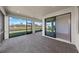 Screened lanai with brick floor offers views of the waterfront at 3065 Winding Creek Trl, North Port, FL 34289