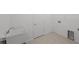Functional laundry room features a utility sink and hookups for appliances, making laundry tasks easier at 3065 Winding Creek Trl, North Port, FL 34289
