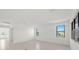 Bright living room featuring an open floor plan and large windows that let in natural light at 3065 Winding Creek Trl, North Port, FL 34289