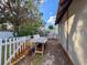 Side yard with white picket fence and work table at 338 Country Club Dr, Oldsmar, FL 34677