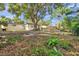 Expansive backyard with mature tree providing shade at 3534 Bluebird Dr, New Port Richey, FL 34652