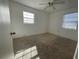 Cozy carpeted bedroom with ample natural light at 4109 E Hanna Ave, Tampa, FL 33610