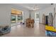 Living room with access to a screened porch and water views at 420 Doric Ct, Tarpon Springs, FL 34689