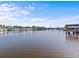 Calm canal with boats and lush greenery at 420 Doric Ct, Tarpon Springs, FL 34689