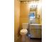 Clean bathroom with a toilet, sink, and vanity at 4337 Tahitian Gardens Cir # B, Holiday, FL 34691