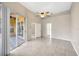 Spacious bedroom with tile floors and sliding glass doors at 4511 Oak River Cir, Valrico, FL 33596