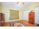 Bright bedroom with hardwood floors and ample closet space at 641 Westfield Ct, Dunedin, FL 34698