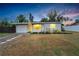 Charming single-story home with a well-manicured lawn, attached garage, and inviting curb appeal at 6524 14Th N St, St Petersburg, FL 33702