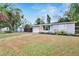 Charming single-story home features an attached garage, well-maintained lawn, and inviting front entrance at 6524 14Th N St, St Petersburg, FL 33702