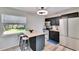 Bright kitchen with a breakfast bar, modern appliances, and ample cabinet space at 6524 14Th N St, St Petersburg, FL 33702