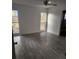 Large bedroom with tile flooring and multiple windows at 6923 Spanish Moss Cir, Tampa, FL 33625