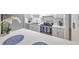 White quartz kitchen countertops with blue placemats at 782 Village Lake N Ter # 107, St Petersburg, FL 33716