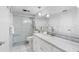 Bathroom with marble vanity and walk-in shower at 7871 Sailboat Key S Blvd # 106, South Pasadena, FL 33707