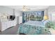 King-size bed, water views, and plenty of dresser space at 7871 Sailboat Key S Blvd # 106, South Pasadena, FL 33707