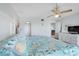 Main bedroom with king-size bed and access to a balcony at 7871 Sailboat Key S Blvd # 106, South Pasadena, FL 33707