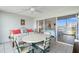 Relaxing lanai with outdoor dining set and view into bedroom at 7871 Sailboat Key S Blvd # 106, South Pasadena, FL 33707