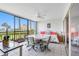 Peaceful lanai with table and chairs, daybed, and sliding doors to water views at 7871 Sailboat Key S Blvd # 106, South Pasadena, FL 33707