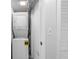 Stackable washer and dryer in a dedicated laundry room at 7871 Sailboat Key S Blvd # 106, South Pasadena, FL 33707
