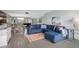 Comfortable living room with sectional sofa, area rug, and views to dining area at 7871 Sailboat Key S Blvd # 106, South Pasadena, FL 33707