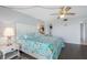 Bright main bedroom with king-size bed and coastal decor at 7871 Sailboat Key S Blvd # 106, South Pasadena, FL 33707
